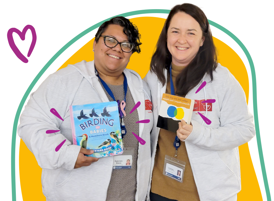 Two Women Holding Childrens Books for ROR